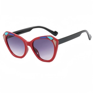 Fashionable cat eye sunglasses with colorful patchwork frames and purple gradient lenses