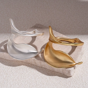 Minimalist organic leaf-shaped matte metal open cuff bracelet in gold and silver finish
