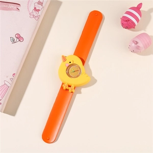 Detail of yellow chick silicone snap watch with orange strap and analog clock face