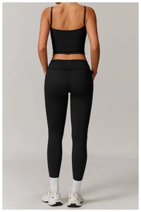Rear view of black recycled yoga set featuring slim strap top and high-waist leggings