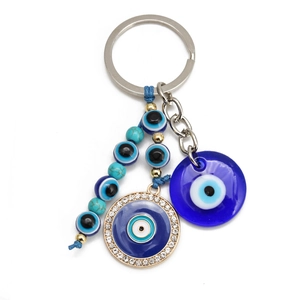 Detail shot of Evil Eye keychain with blue resin beads and sparkling crystal accents