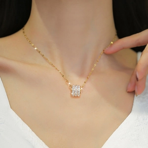 Titanium steel necklace with crystal cylinder pendant on a female model collarbone