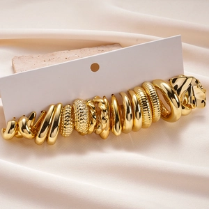 20-piece set of gold geometric textured earrings with hoop and leopard head designs