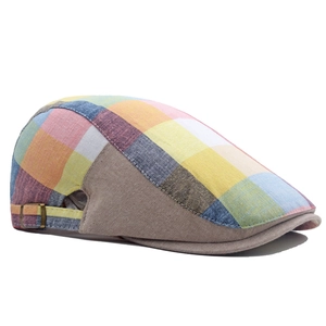Close-up of a colorful plaid ivy cap featuring a metal buckle and breathable cotton fabric