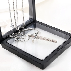 Silver stainless steel cross necklace with Philippians 4:13 engraving in a display box