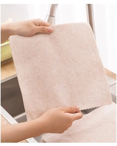 Pink microfiber kitchen cleaning cloth showing wave edge texture in the sink