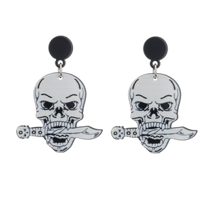Macro detail of gothic skull with sword acrylic earrings in punk black and white style