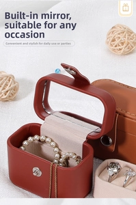 Mini PU leather jewelry box detail showing built-in mirror and ring storage slots