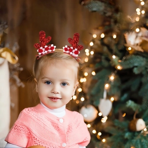 Glittery Christmas reindeer antler hair clips for kids with red pom poms and bells