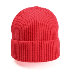 Close-up of a red ribbed knit beanie showing thick texture and warm winter material