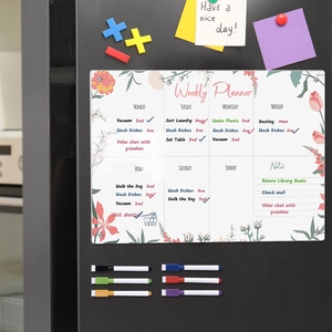 Detail of acrylic weekly planner for fridge with floral patterns and six colorful markers