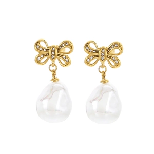 Elegant gold bow earrings with crystal pavé and baroque shell pearl drops