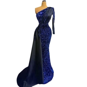 Royal blue sequin mermaid evening gown with one-shoulder sleeve and satin sash detail