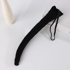 Detail of black plush animal tail prop with elastic loop for cosplay costumes