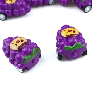 Creative purple grape fruit toy pull-back car with cute cartoon face on white background