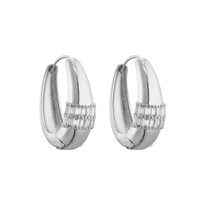 Macro shot of silver hoop earrings with three rows of square cubic zirconia stones