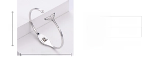 Size chart showing 60mm by 50mm inner diameter of a silver dolphin tail bangle