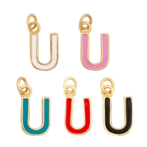 Detail of colorful enamel letter U pendants in five vibrant colors with gold metal frames