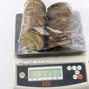 Macro shot of natural round wood slices with bark and pre-cut card slots for display stand