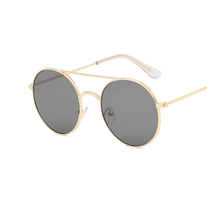 Retro round metal sunglasses with gold double bridge and dark grey lenses on white background