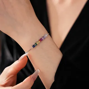 Adjustable silver bracelet featuring rainbow gradient rectangular cubic zirconia gems