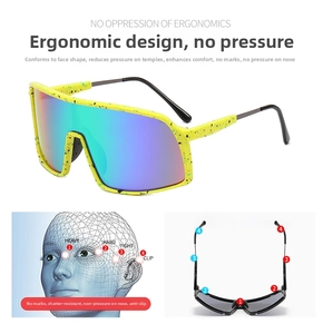 Detailed view of yellow splash-pattern cycling sunglasses with ergonomic frame analysis