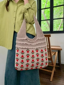 Detailed close-up of knitted floral pattern and mesh texture on the summer tote bag