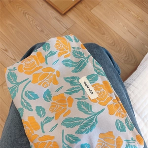 Close-up of fabric bag with yellow rose floral print and Simple Wish label