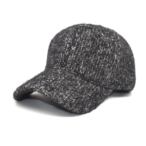 Warm grey cable knit baseball cap for women with thick wool-like texture and classic peak