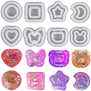 Détail macro de 8 moules en silicone pour résine DIY incluant formes cœur et étoile