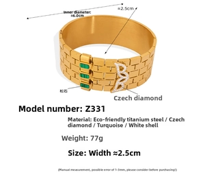 Detail of gold titanium steel cuff bracelet with turquoise stones and rhinestone B charm
