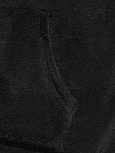 Close-up of black coral fleece fabric showing soft texture and pocket stitching detail