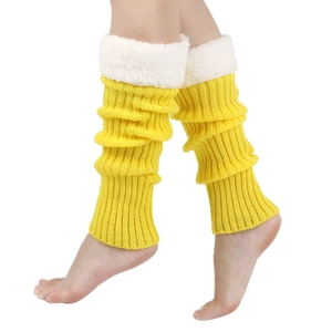 Detail of yellow knit leg warmers featuring cozy white faux fur trim and soft lining