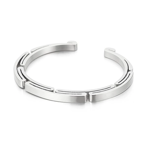 Minimalist silver stainless steel open bracelet with geometric segmented industrial design