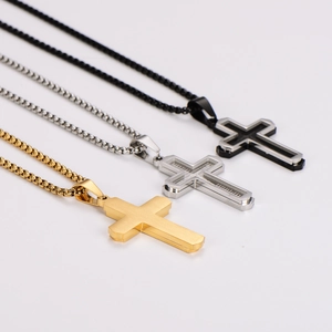 Three minimalist stainless steel cross necklaces in gold, silver and black colors