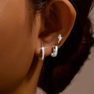 Detailed view of s925 silver earring set with turquoise studs and pave hoop earrings