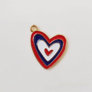 Detailed macro view of colorful enamel heart pendants with gold plated alloy edges