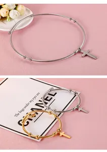 Detailed view of cable texture stainless steel cross bracelet and necklace set