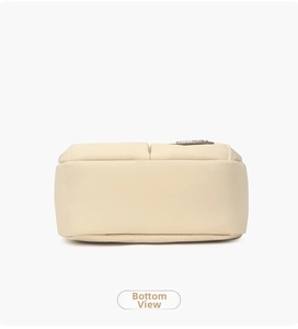Detailed bottom view of the beige nylon crossbody bag showing neat stitching and flat base