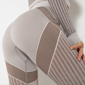 Seamless high waist yoga pants and long sleeve top set with color-block knit patterns