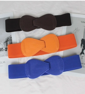 Three-piece set of wide elastic waist belts with bow buckles in black, orange, and royal blue