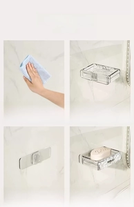 Four-step installation guide for wall-mounted clear soap dish on marble tile surface