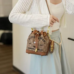 Retro brown drawstring bucket bag with bear print and small round coin purse charm