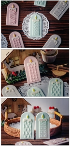 Detailed view of pastel Christmas candlestick fondant molds with embossed patterns for baking