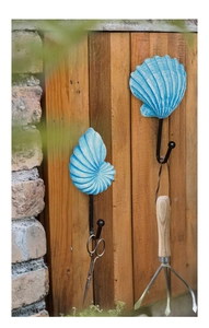 Detail of blue seashell and nautilus wall hooks in retro Mediterranean style iron resin