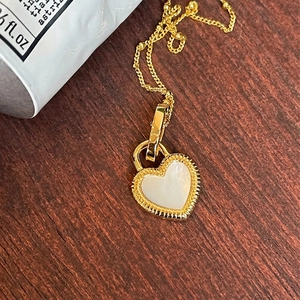 Elegant gold sterling silver heart pendant necklace with white mother of pearl inlay