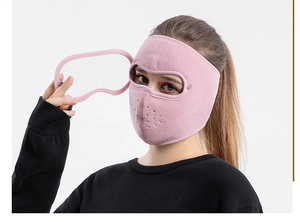 Detailed view of pink fleece thermal face mask with breathable vents and ear loops