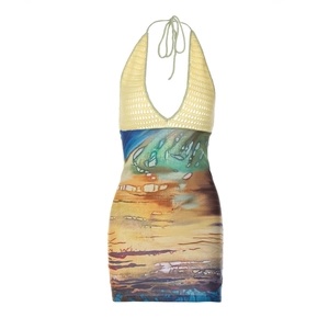 Sexy halter neck mini dress featuring yellow knit top and abstract landscape print skirt