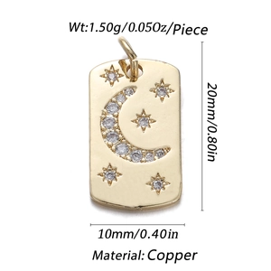 Gold celestial copper pendant with moon star patterns and cubic zirconia detailing