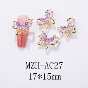 Macro shot of 17x15mm purple gradient butterfly nail charms with pearl and rhinestone edges
